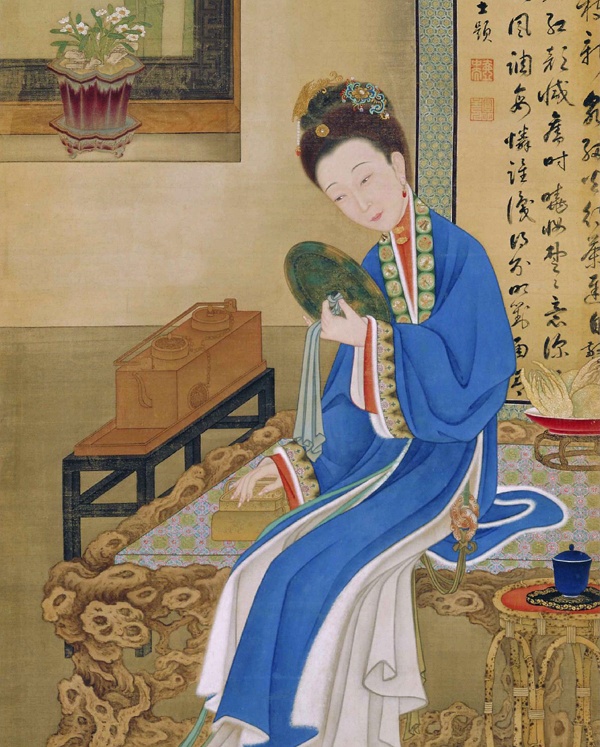 裘装对镜图中的佛手香橼，一旁的水仙也揭示其季节